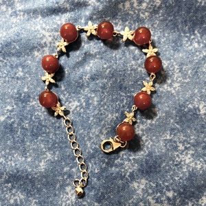 Silvertone bracelet with flowers